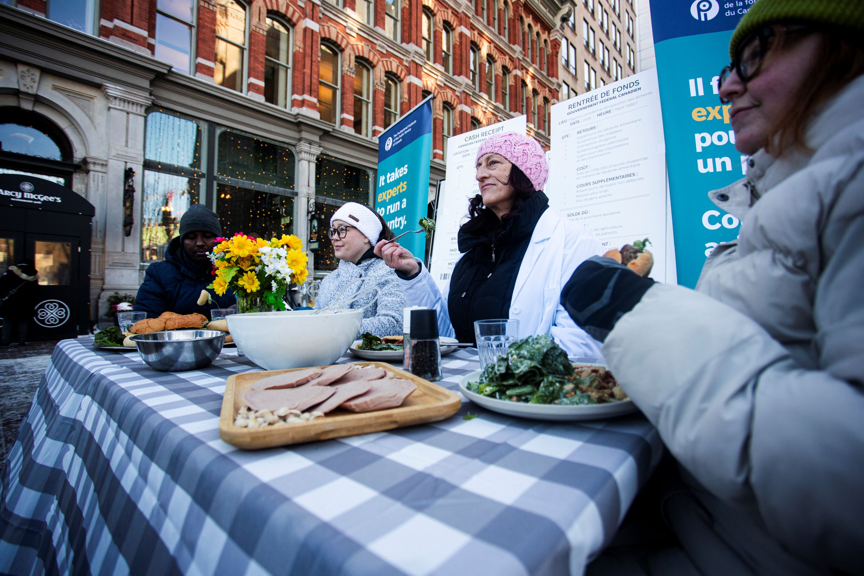 Against the backdrop of a Canadian dining table set with commonly recalled food products, food safety professionals warned today that federal cuts to the Canadian Food Inspection Agency (CFIA) are weakening Canada’s ability to prevent foodborne illness.